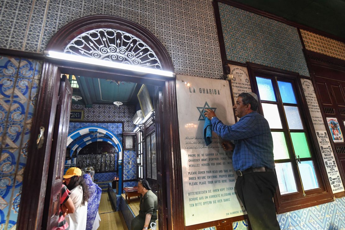 A man cleans a plaque at the Ghriba synagogue in the Tunisian resort island of Djerba on Tuesday, on the eve of the annual Jewish pilgrimage to the synagogue. Dating back to Roman times and once numbering 100,000 people, the Jewish community in Tunisia has shrunk to a mere 2,000 after fear, poverty and discrimination drove waves of emigration after the creation of Israel in 1948. There are more than 1,200 Jews in Djerba. 