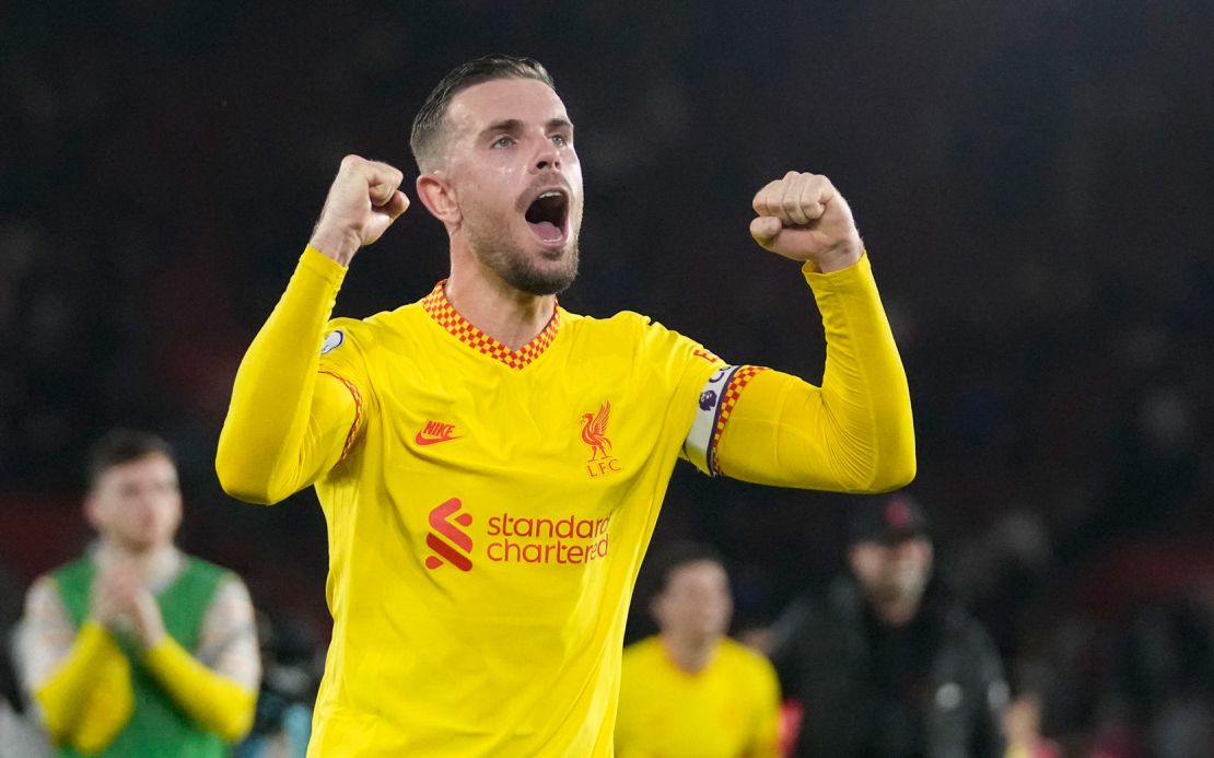 Liverpool's Jordan Henderson celebrates a crucial victory for his team.