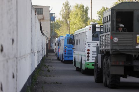 Buses with Ukrainian servicemen evacuated from the Azovstal steel plant wait near a prison in Olyonivka on May 17. The steel plant was the last holdout in Mariupol, a city that had become a symbol of Ukrainian resistance under relentless Russian bombardment.