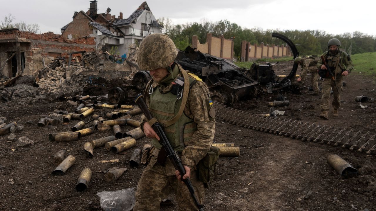 Ukrainian servicemen patrol in a recently retaken village, north of Kharkiv, east Ukraine, Sunday, May 15, 2022. (AP Photo/Mstyslav Chernov)