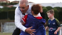 DEVONPORT, AUSTRALIA - MAY 18: Prime Minister Scott Morrison accidentally knocks over a child during a visit to the Devonport Strikers Soccer Club, which is in the electorate of Braddon, on May 18, 2022 in Devonport, Australia. The Australian federal election will be held on Saturday 21 May. (Photo by Asanka Ratnayake/Getty Images)