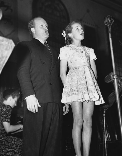 An 11-year-old Andrews sings at a Fleet Street Club luncheon in 1946. Andrews was born Julia Elizabeth Wells in Walton-on-Thames, England. She would later take the last name of her stepfather, Ted Andrews.