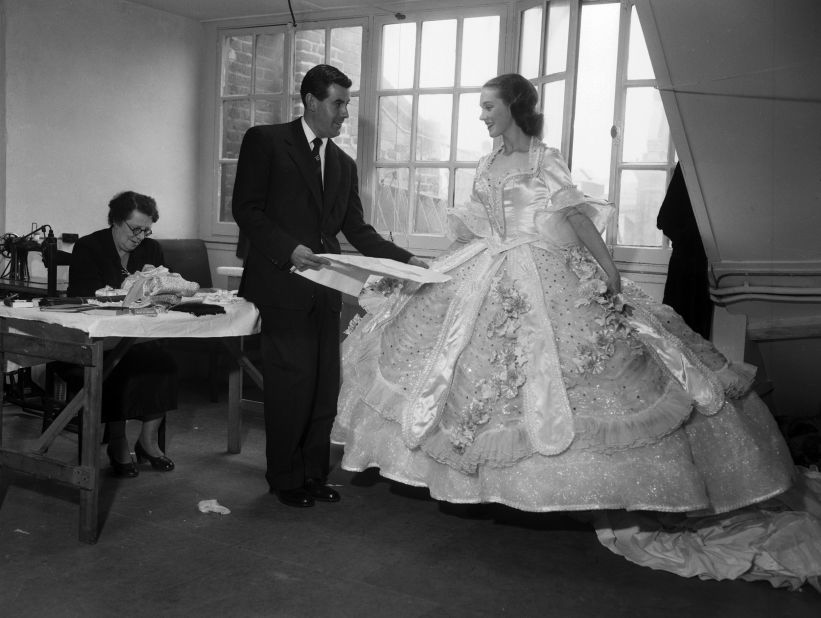 Andrews tries on a dress for a "Cinderella" role at the London Palladium in 1953.