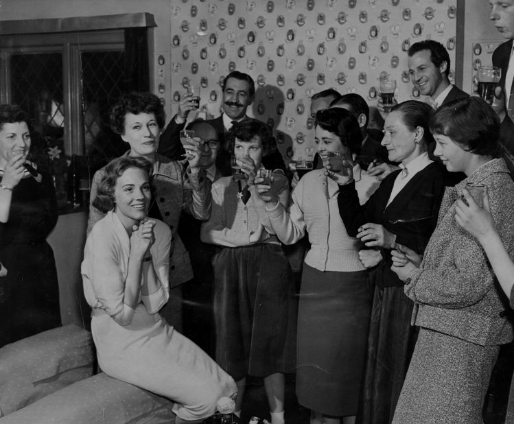 Andrews is toasted by friends and neighbors at a homecoming party in 1958.