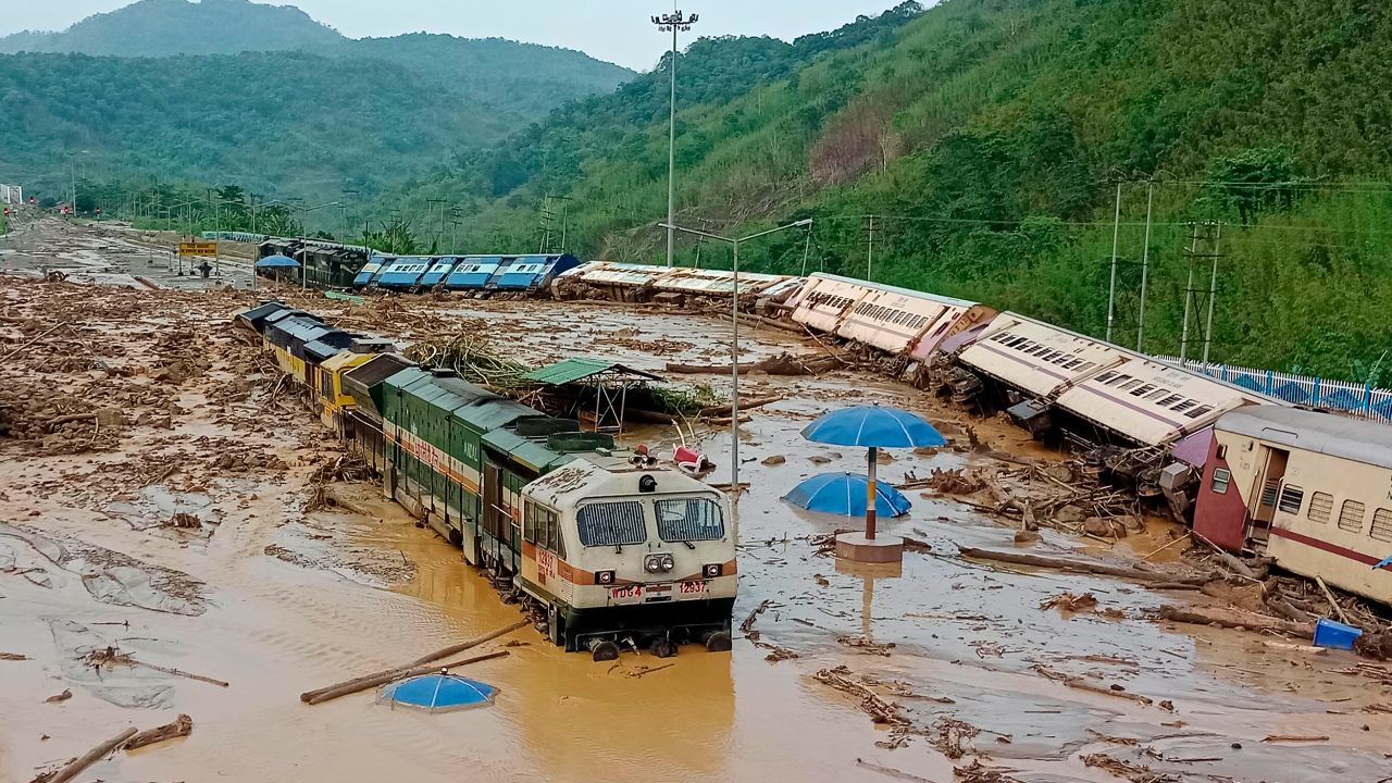 Train coaches toppled over after mudslides triggered by heavy rains at the New Haflong railway station in Assam, India, on May 16.
