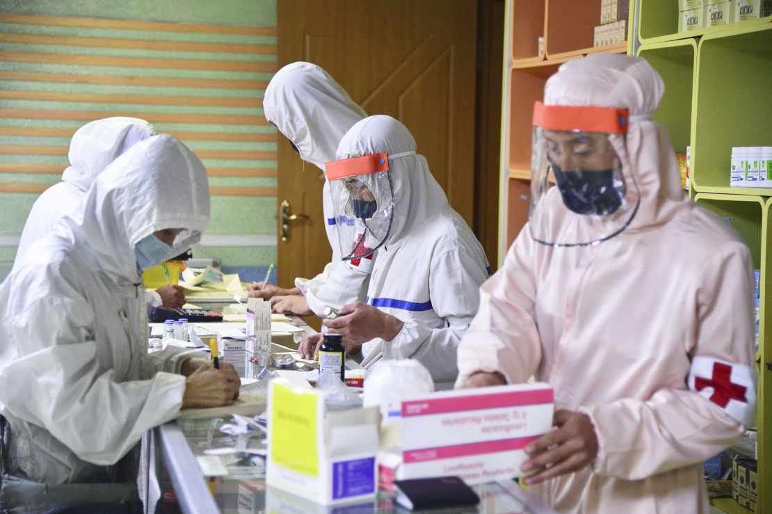 Members of the North Korean military's medical section distribute medicine at a pharmacy in Pyongyang on May 18.
