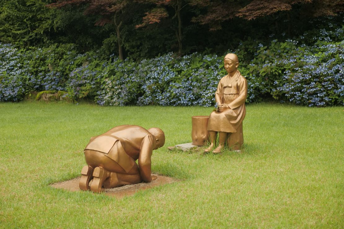 A statue symbolizing Japanese Prime Minister Shinzo Abe taking a deep bow to "comfort woman" is pictured at the Korea Botanic Garden in Pyeongchang, South Korea, on July 28, 2020.    