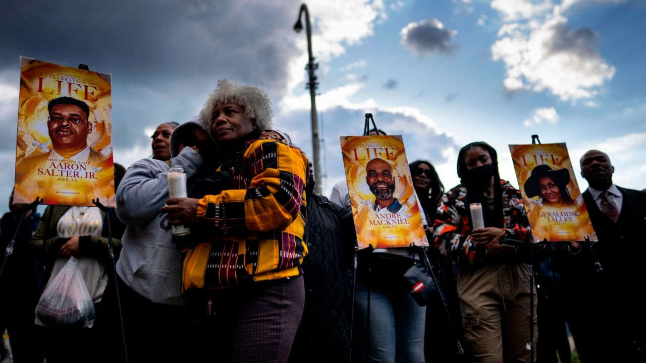 Residents hold a vigil across the street from Tops Friendly Market in Buffalo, New York, the site of a fatal shooting last weekend that left 10 people dead. 