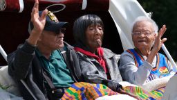 Tulsa race massacre survivors, Hughes Van Ellis , Lessie Randle and Viola Fletcher ride in a carriage at the front of the Black Wall St. Memorial March Friday, May 28, 2021.Black Wall St March 10