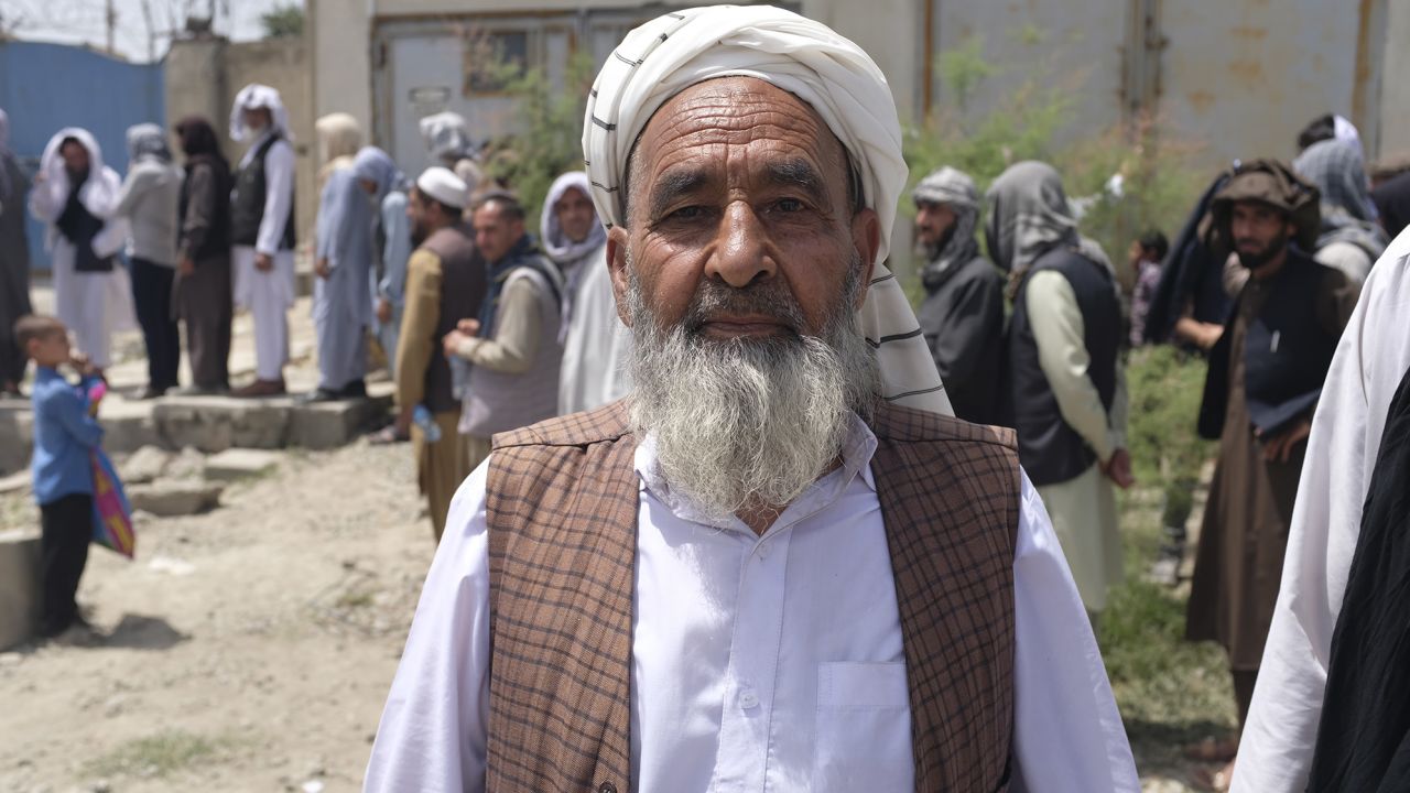 "We want to work with our own hands so we can eat food we have bought with our own money," says Haji Noor Ahmad, as he waits for WFP aid.