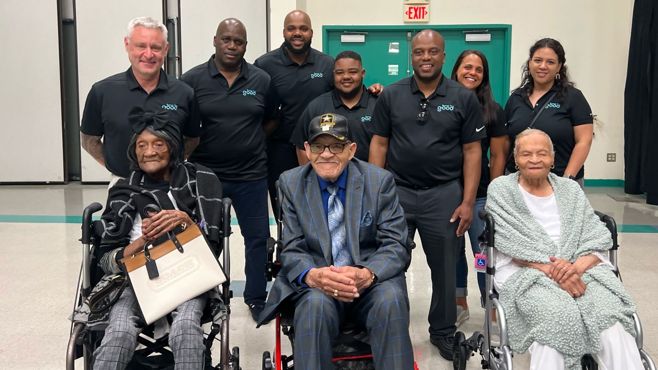 Ed Mitzen, top left, and his staff at the nonprofit Business for Good, met the Tulsa race massacre survivors Viola Fletcher, 108, Hughes "Uncle Red" Van Ellis, 101, and Lessie Benningfield Randle, 107, on May 18, 2022 in Tulsa. 