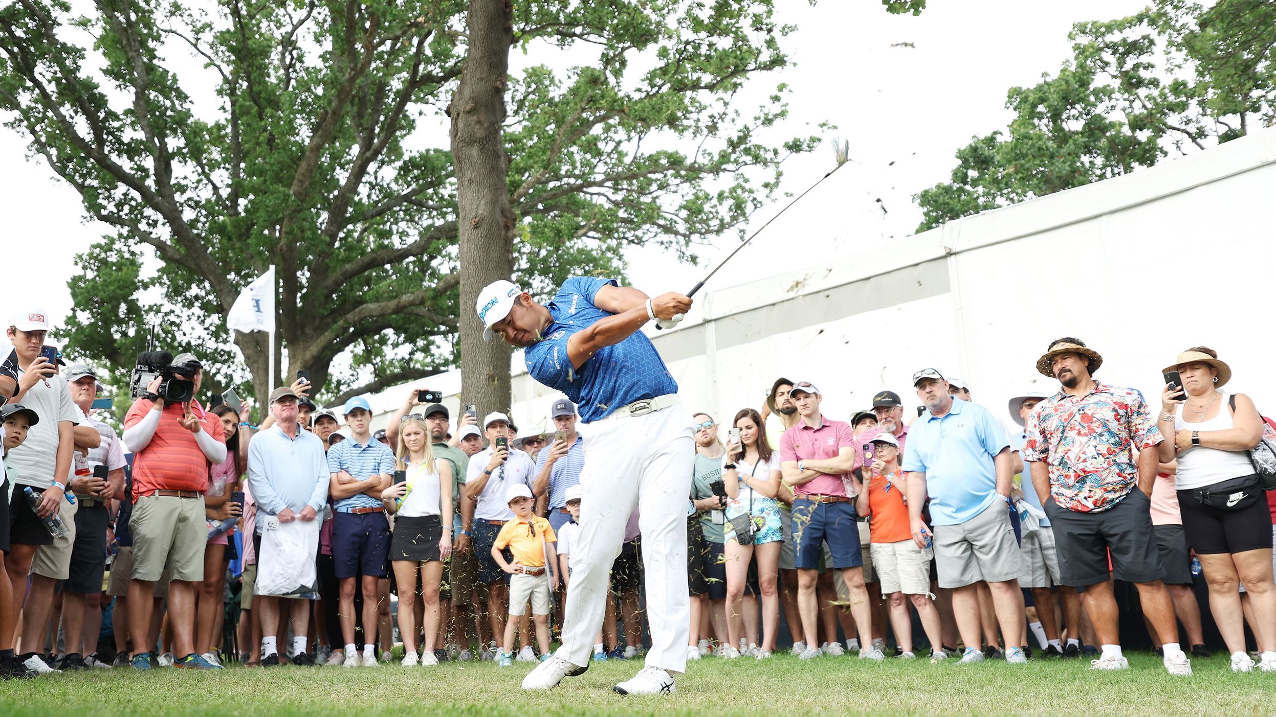 Hideki Matsuyama plays his shot from the 13th tee during the first round.