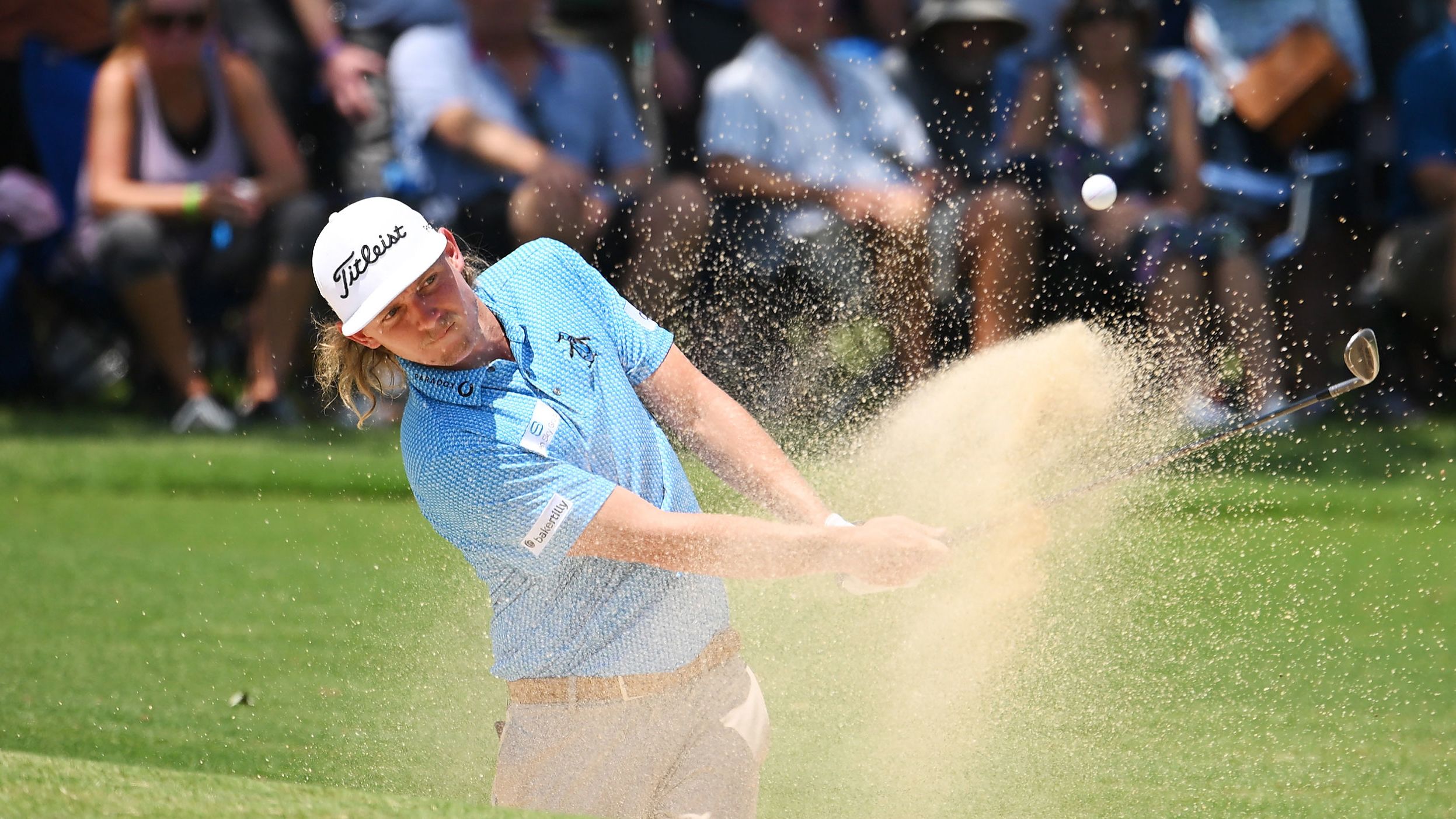 Cameron Smith plays a shot from a bunker on the eighth hole during the first round.