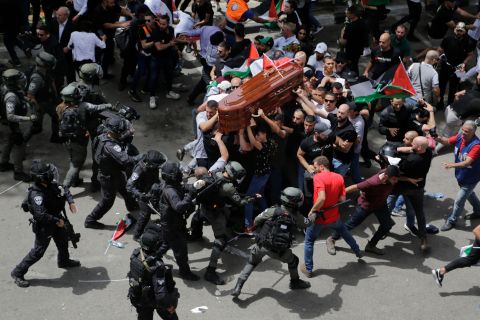 <a href="https://www.cnn.com/2022/05/13/business/abu-akleh-funeral-jerusalem-intl/index.html" target="_blank">Israeli police confront mourners</a> in Jerusalem on Friday, May 13, as they carry the casket of veteran Al Jazeera journalist Shireen Abu Akleh, who was <a href="https://www.cnn.com/2022/05/11/middleeast/al-jazeera-journalist-killed-intl-hnk/index.html" target="_blank">shot dead</a> two days earlier while reporting on a military raid in the West Bank city of Jenin. Mourners carrying Abu Akleh's coffin out of a hospital were met with violence from Israeli police who compelled them to transport the body by car. Israeli police in a statement said that "hundreds of rioters began to disrupt public order, even before the funeral began," as they worked to secure the procession.