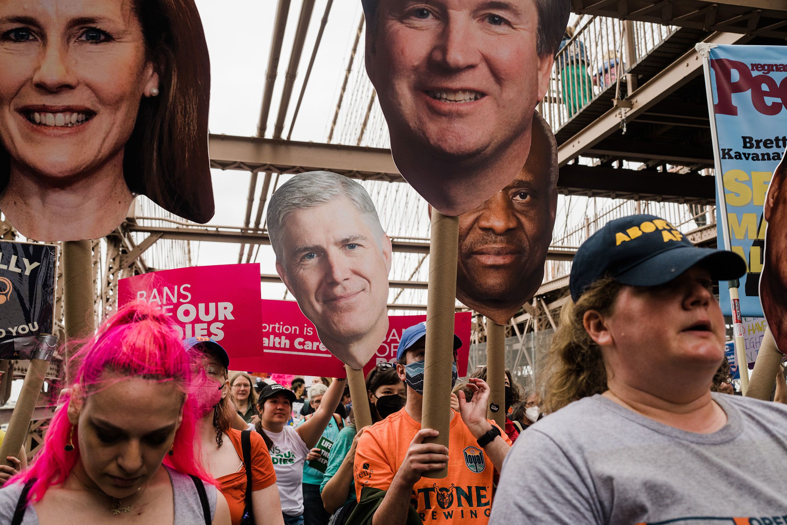 Abortion rights demonstrators walk across the Brooklyn Bridge.