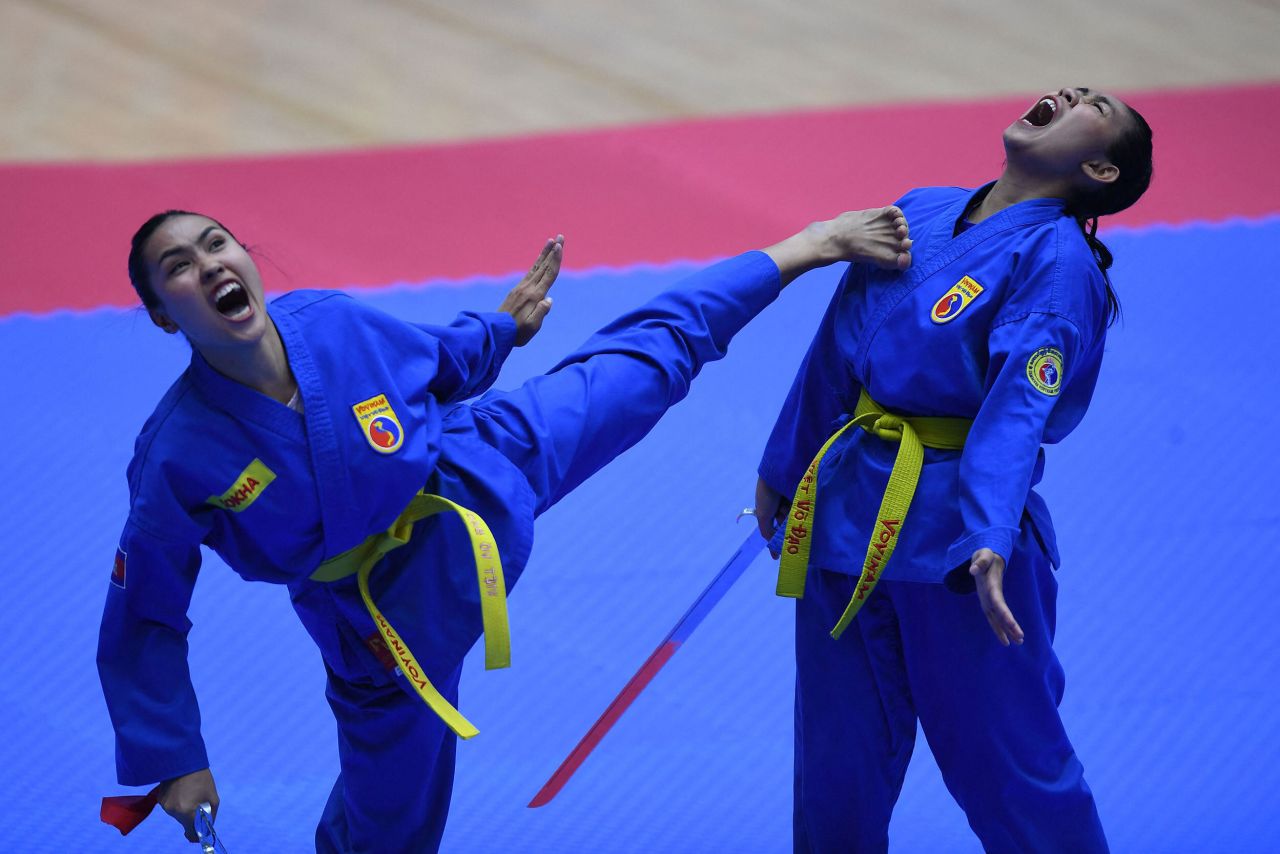 Cambodia's Pov Sokha and Soeur Chanleakhena compete in the female pair sword form category of the vovinam event during the 31st Southeast Asian Games in Hanoi, Vietnam, on Thursday, May 19.