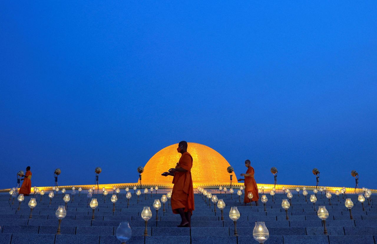 Buddhist monks turn on LED lights to form an image of Buddha on Sunday, May 15, at the Dhammakaya Temple in the Pathum Thani Province north of Bangkok. They were observing Vesak Day, an annual celebration of Buddha's birth, enlightenment and death.