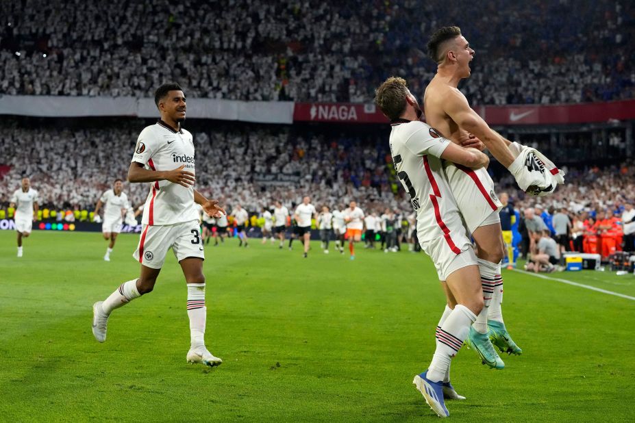 Frankfurt's Rafael Borre, right, celebrates with teammates after scoring the winning penalty during a shootout at the end of the <a href="https://www.cnn.com/2022/05/18/football/rangers-eintracht-frankfurt-europa-league-final-spt-intl/index.html" target="_blank">UEFA Europa League final</a> match against the Glasgow Rangers in Seville, Spain, on Wednesday, May 18. Frankfurt beat Glasgow 5-4 in a dramatic penalty shootout following a 1-1 draw. 