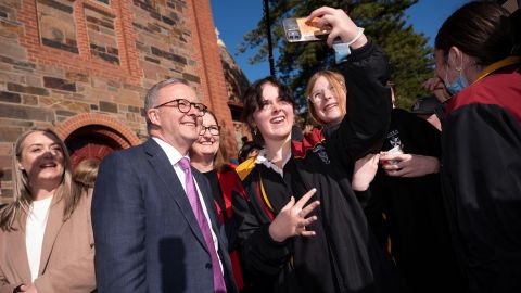 Opposition Labor Party leader Anthony Albanese poses with students at Cobra Dominican College in Adelaide on May 20.