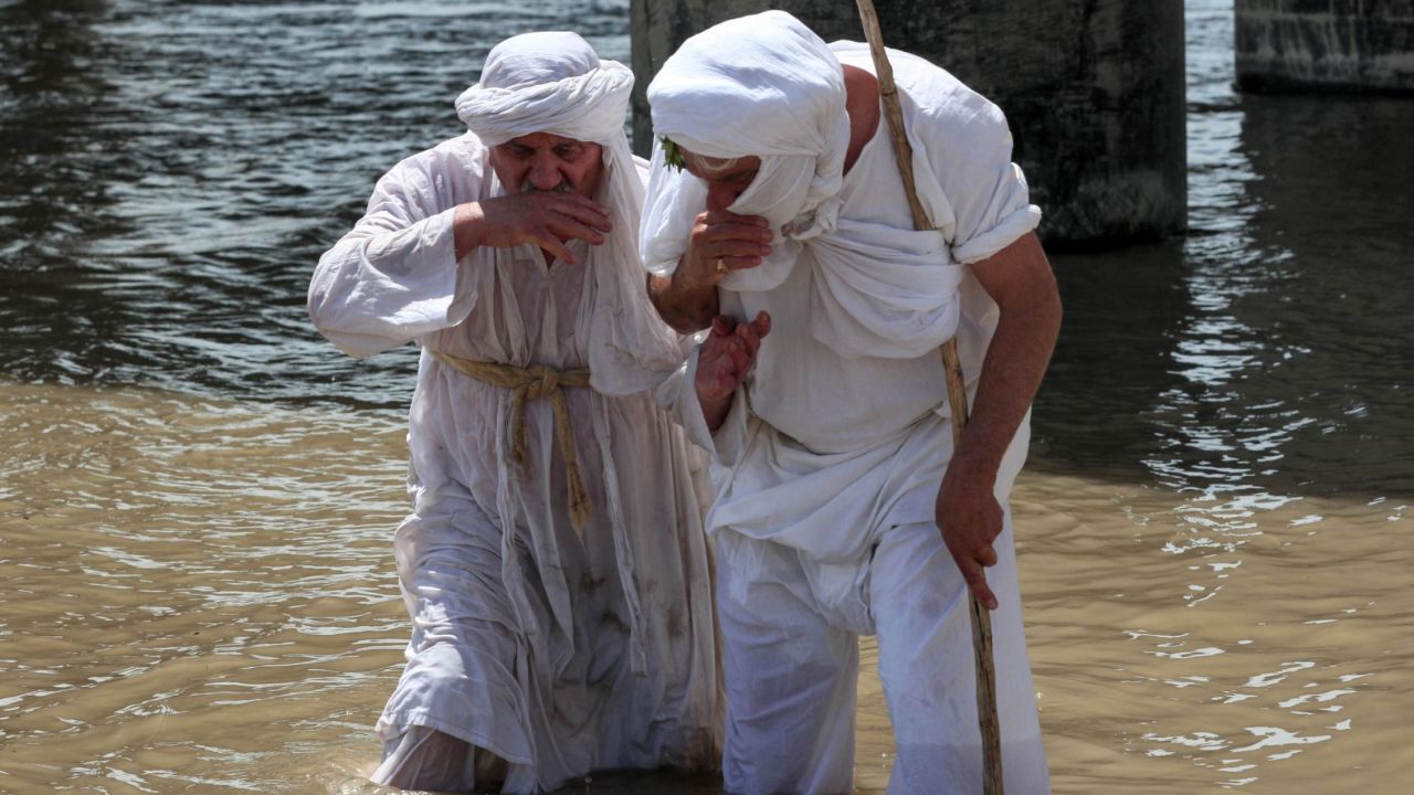 Sabean worshippers, followers of a pre-Christian religion which considers the prophet Abraham as one of the founders of its faith, take part in a cleansing ritual, known as the "Golden Cleansing," along the banks of the Great Zab river in the Kurdish town of Khabat, in northern Iraq on May 18. 