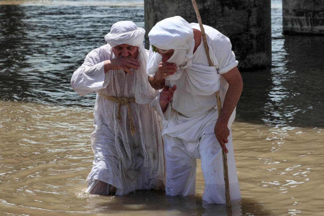 Sabean worshippers, followers of a pre-Christian religion which considers the prophet Abraham as one of the founders of its faith, take part in a cleansing ritual, known as the "Golden Cleansing," along the banks of the Great Zab river in the Kurdish town of Khabat, in northern Iraq on May 18. 