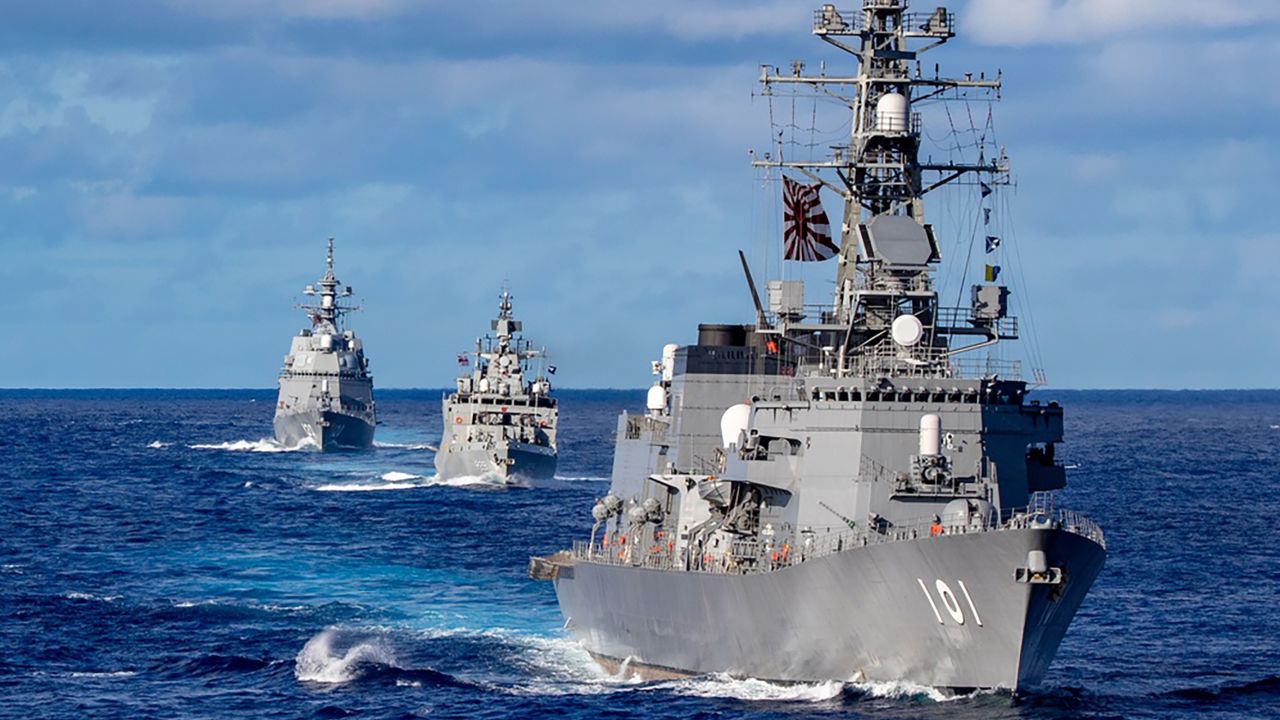 Japanese, Indian and Australian ships sail in formation during Malabar exercises in August 2021.