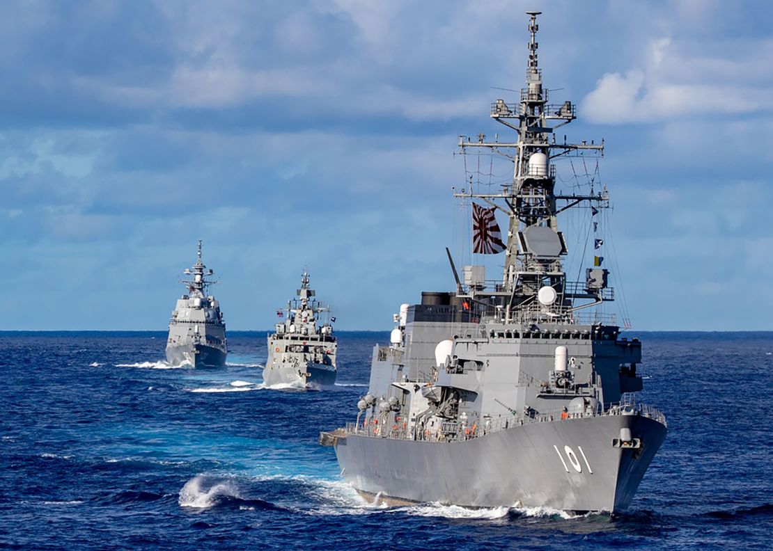 Japanese, Indian and Australian ships sail in formation during Malabar exercises in August 2021.