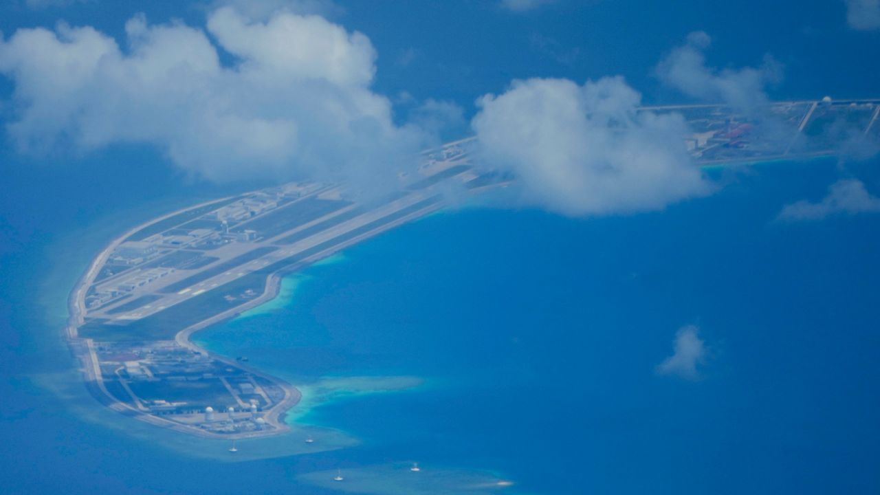 A Chinese air strip is clearly visible beside structures and buildings on the contested Mischief Reef in the Spratly group of islands in the South China Sea, March 20, 2022. 