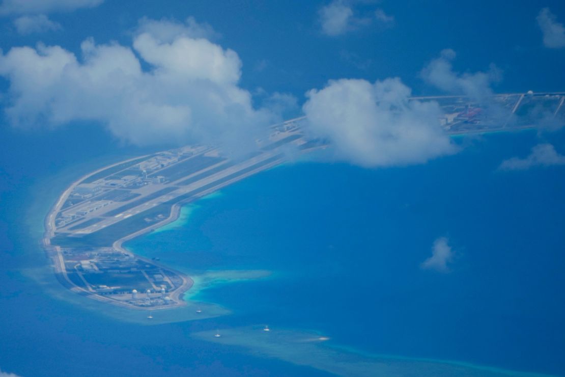A Chinese air strip is clearly visible beside structures and buildings on the contested Mischief Reef in the Spratly group of islands in the South China Sea, March 20, 2022. 