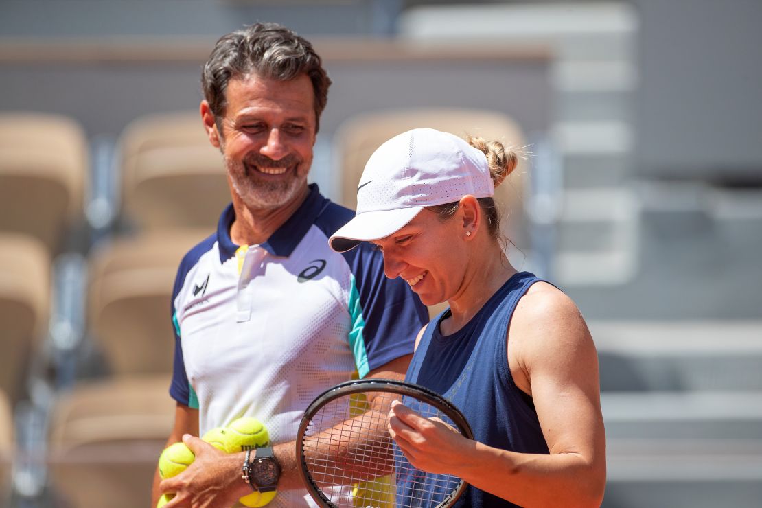 Simona Halep shares a light hearted moments with coach Patrick Mouratoglou during preparation for Roland Garros on May 18, 2022 in Paris, France. 