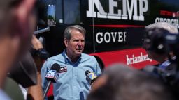 Gov. Brian Kemp talks to the media following a campaign event on May 17, 2022 in Canton, Georgia.
