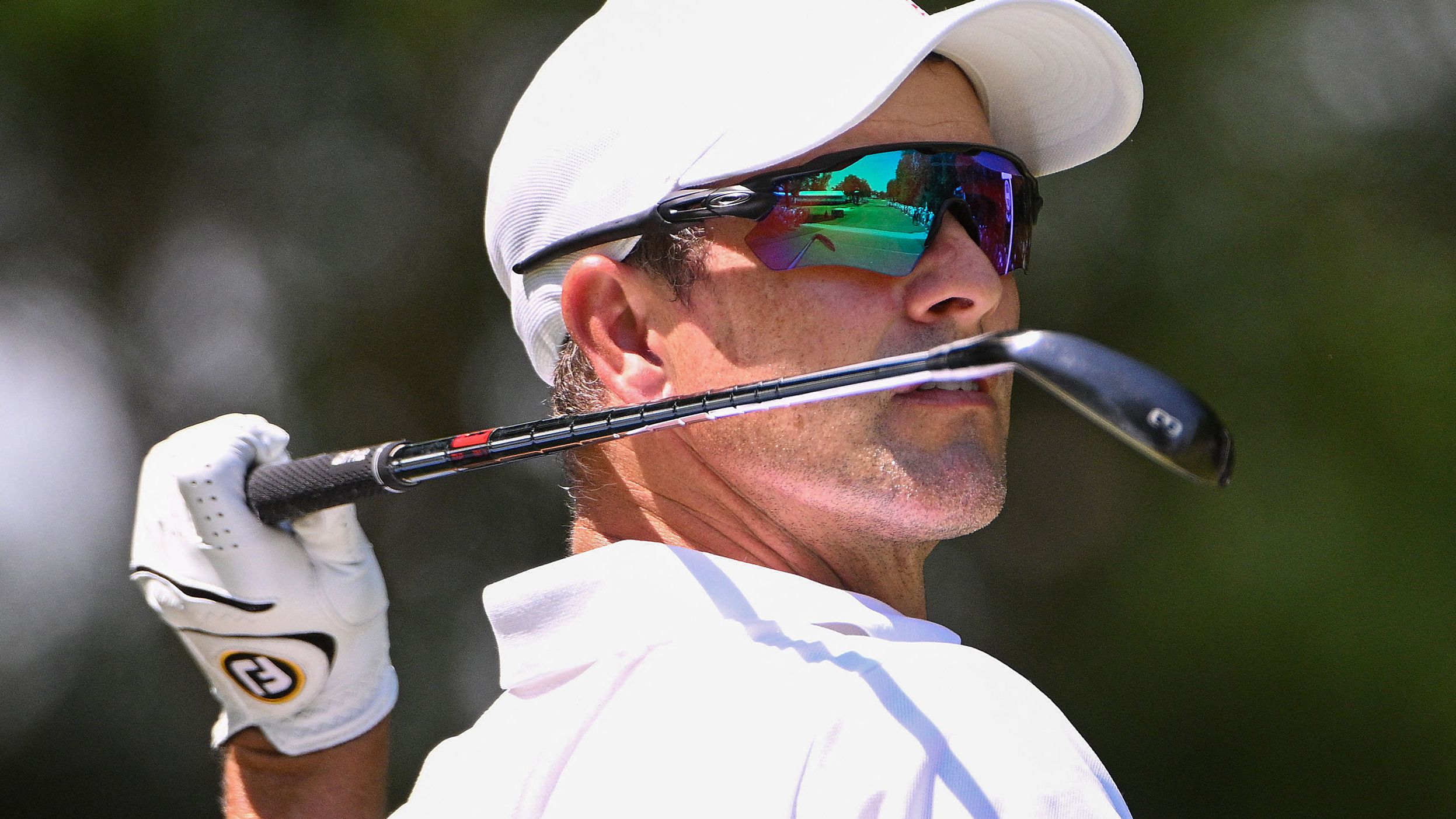 Adam Scott plays a shot on the eighth tee during the first round.