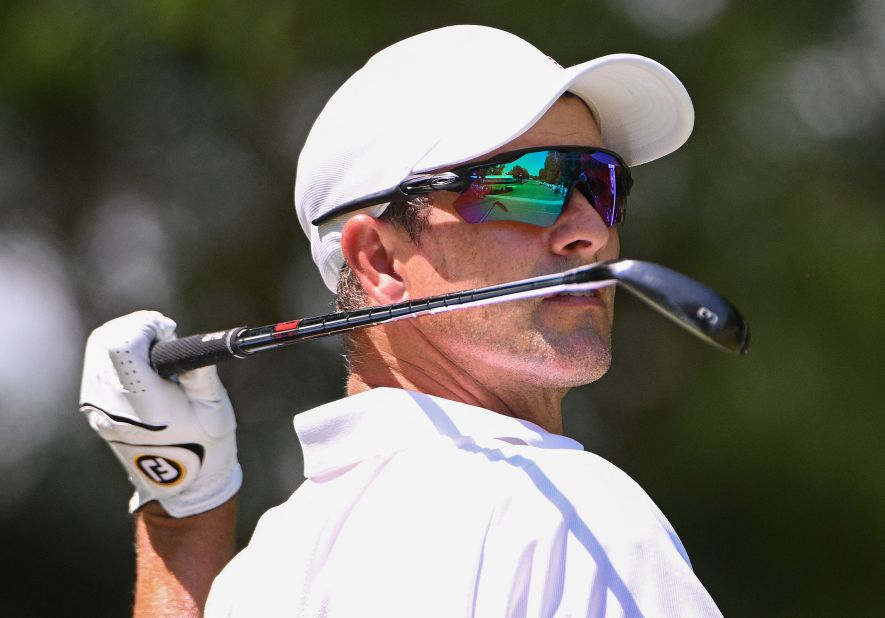 Adam Scott plays a shot on the eighth tee during the first round.