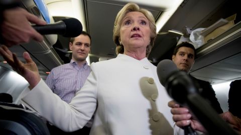 Democratic presidential candidate Hillary Clinton, center, accompanied by Campaign Manager Robby Mook, left, and traveling press secretary Nick Merrill, right, on Oct. 19, 2016.