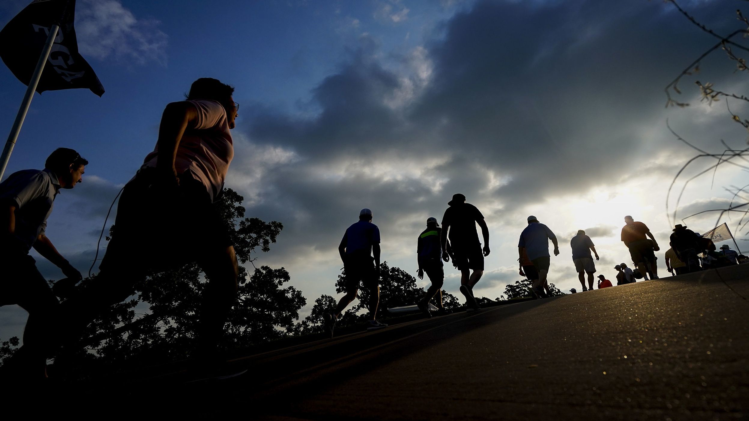 Spectators walk uphill to the first and 10th tee boxes in the second round.