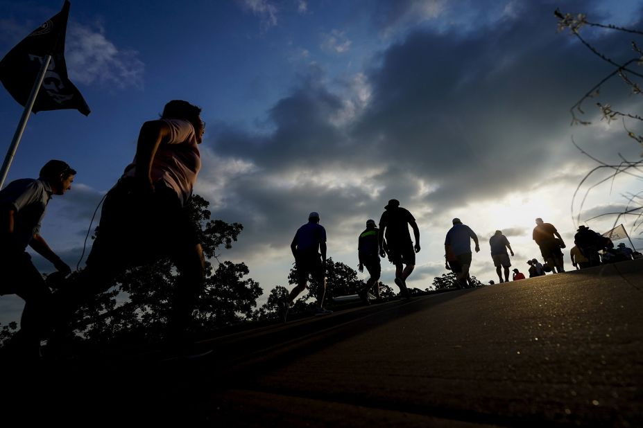 Spectators walk uphill to the first and 10th tee boxes in the second round.