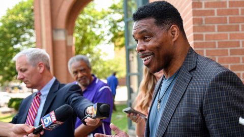 U.S. Senate candidate Herschel Walker speaks with the media after a campaign rally at the Georgia Sports Hall of Fame in Macon, Ga., Wednesday, May 18, 2022.