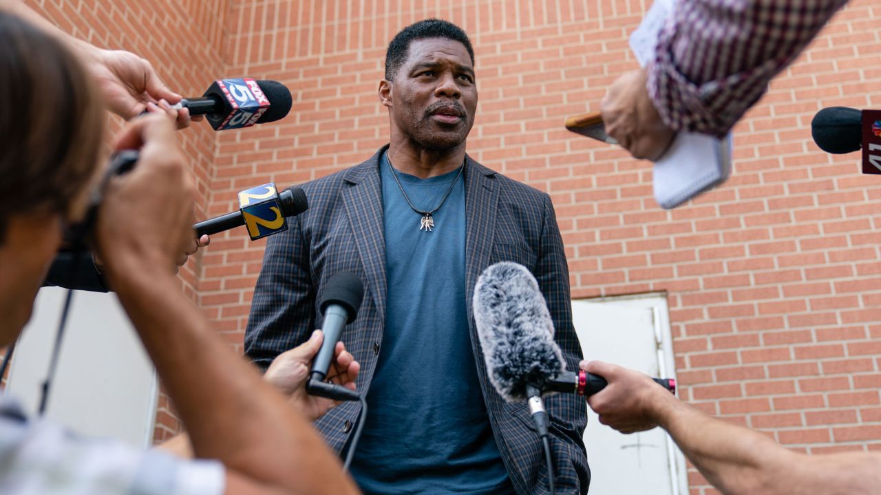 Herschel Walker, US Republican Senate candidate for Georgia, speaks to members of the media following a campaign rally in Macon, Georgia, US, on Wednesday, May 18, 2022. Heisman Trophy-winner Walker is vying to face incumbent Democratic Senator Raphael Warnock in his first political run. 