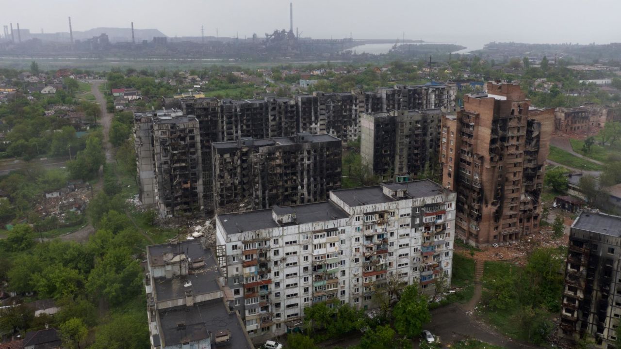 An aerial view of damaged residential buildings and the Azovstal steel plant in the background in the port city of Mariupol on May 18, 2022, amid the ongoing Russian military action in Ukraine.