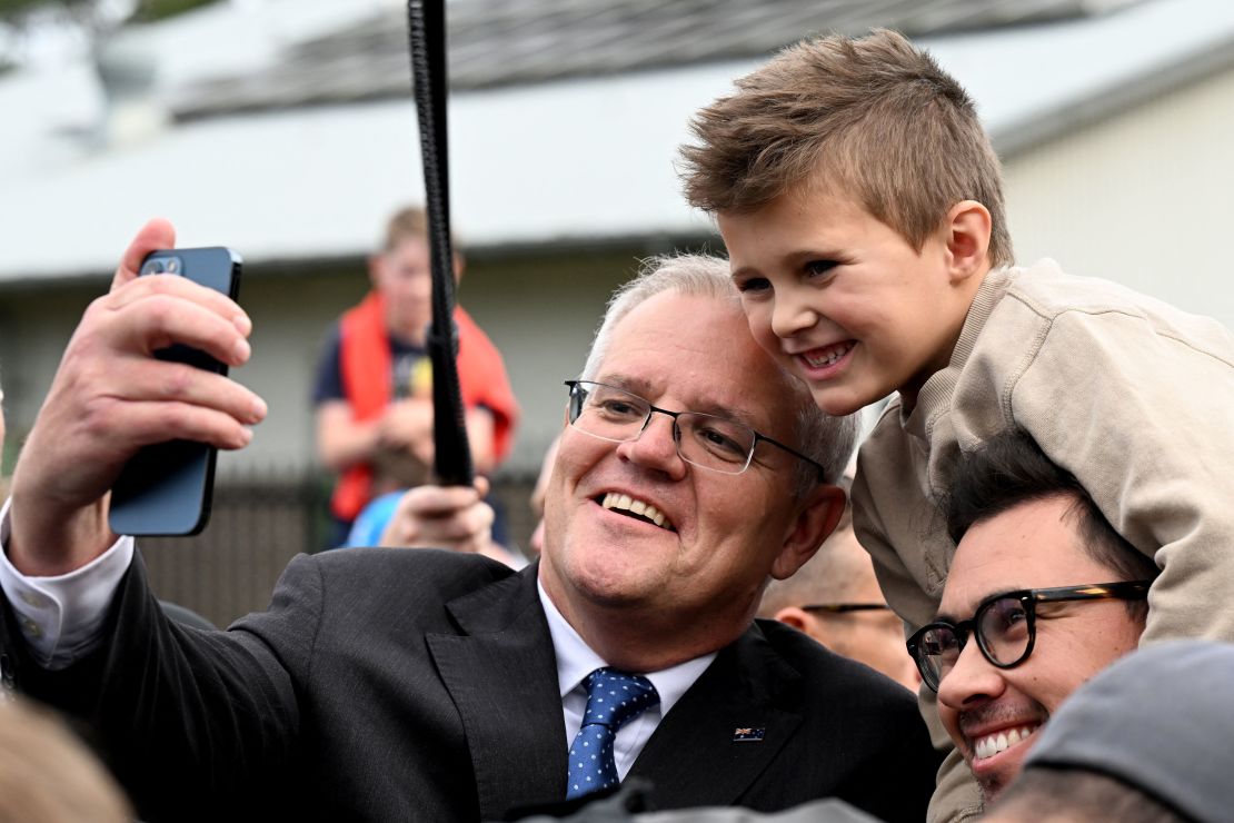 Australian Prime Minister Scott Morrison takes a selfie after casting his vote in Sydney on May 21, 2022.