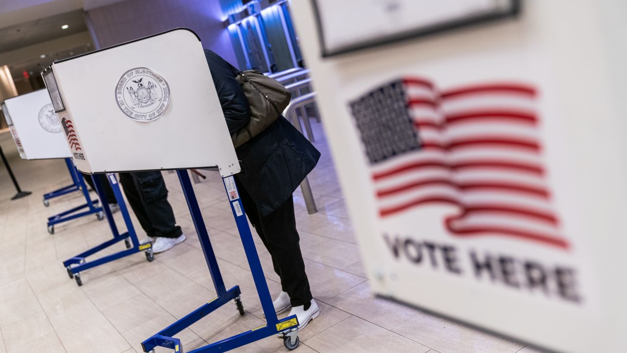 Voters cast ballots at an early voting location in Madison Square Garden in New York City on October 26, 2020.