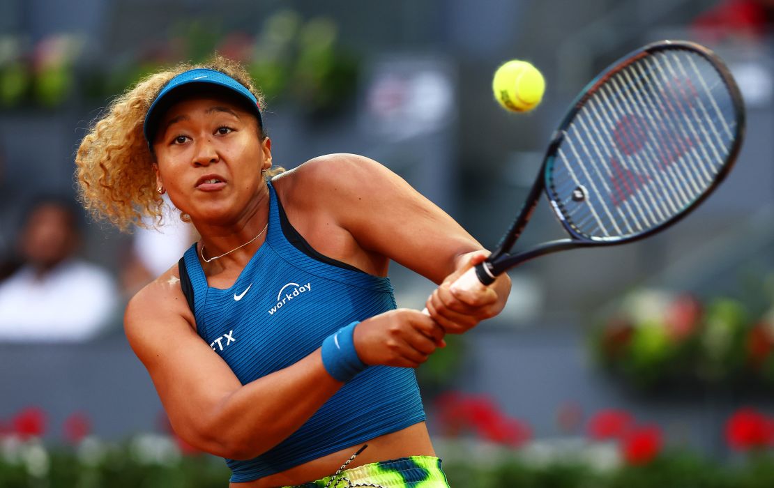 Naomi Osaka of Japan plays a backhand against against Spain's Sara Sorribes Tormo during their round of 32 match on day four of the Mutua Madrid Open at La Caja Magica on May 01, 2022.