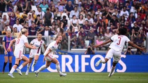 Amandine Henry celebrates with her teammates after scoring Lyon's opening goal against Barcelona.