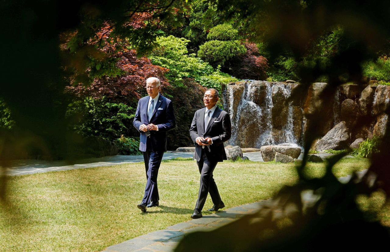 Biden and Hyundai Motor Group Chairman Chung Eui Sun arrive to address the press on the automaker's decision to build a new electric vehicle and battery manufacturing facility in Savannah, Georgia.