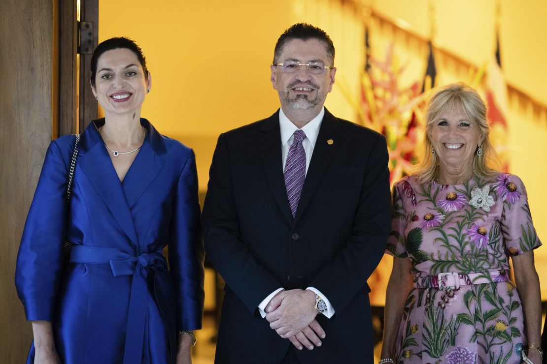 Costa Rican first lady Signe Zeicate, left, Costa Rican President Rodrigo Chaves Robles and first lady Jill Biden pose for a photo at the U.S. Chief of Mission Residence in San José, Costa Rica, Saturday, May 21, 2022.