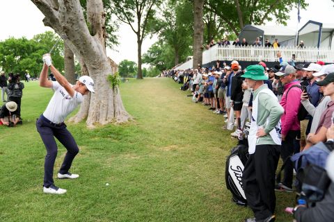 Spectators watch Will Zalatoris hit his shot on the 16th hole during the third round.
