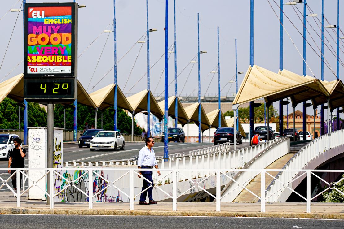 A city thermometer on the Puente del Cachorro bridge reads 42 degrees in Seville.