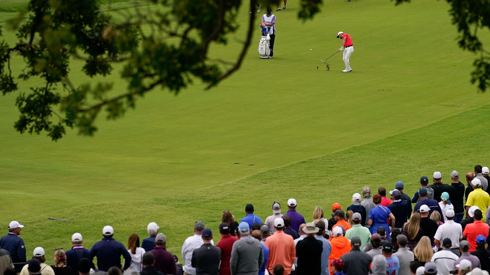 Abraham Ancer hits from the fairway on the fourth hole.