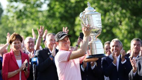 Justin Thomas of the United States celebrates with the Wanamaker Trophy after putting in to win on the 18th green, the third playoff hole during the final round of the 2022 PGA Championship at Southern Hills Country Club on May 22, 2022 in Tulsa, Oklahoma.