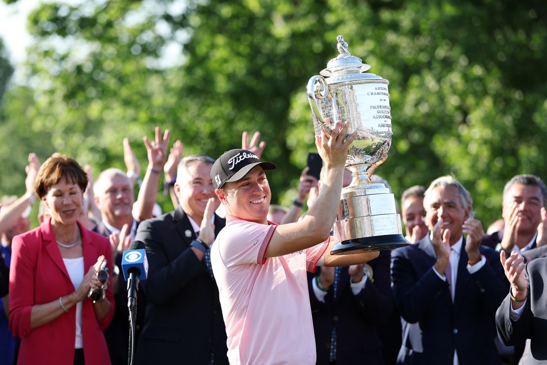Thomas celebrates with the Wanamaker Trophy after winning the 2022 PGA Championship.